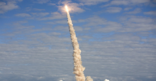 A rocketship launching into space