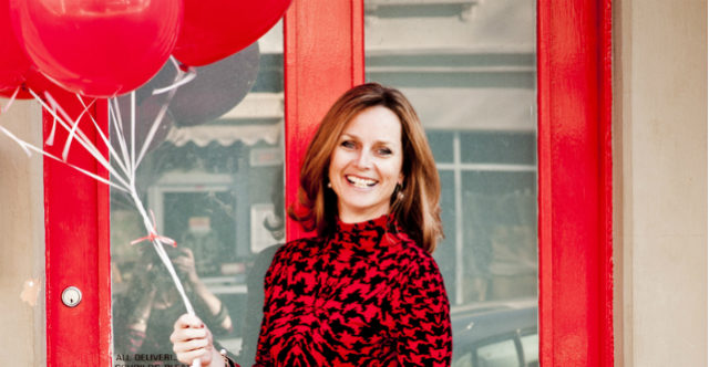 Naomi Simson holding balloons - Red Balloon founder Shark Tank investor